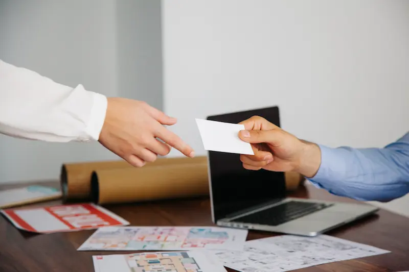 real-estate-agents-interchanging-business-card real-estate-agents-interchanging-business-card